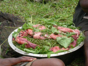 The rest of the pig parts that weren't cooked in the mumu were saved to be cooked with greens at a later time.  They were very excited about this!