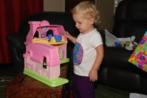 Maycie pretending her doll house was having rolling blackouts just like our real house.