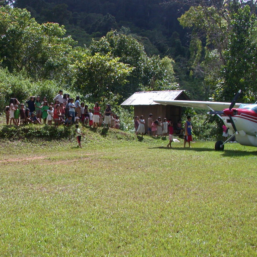 People always gather around the plane when we land.