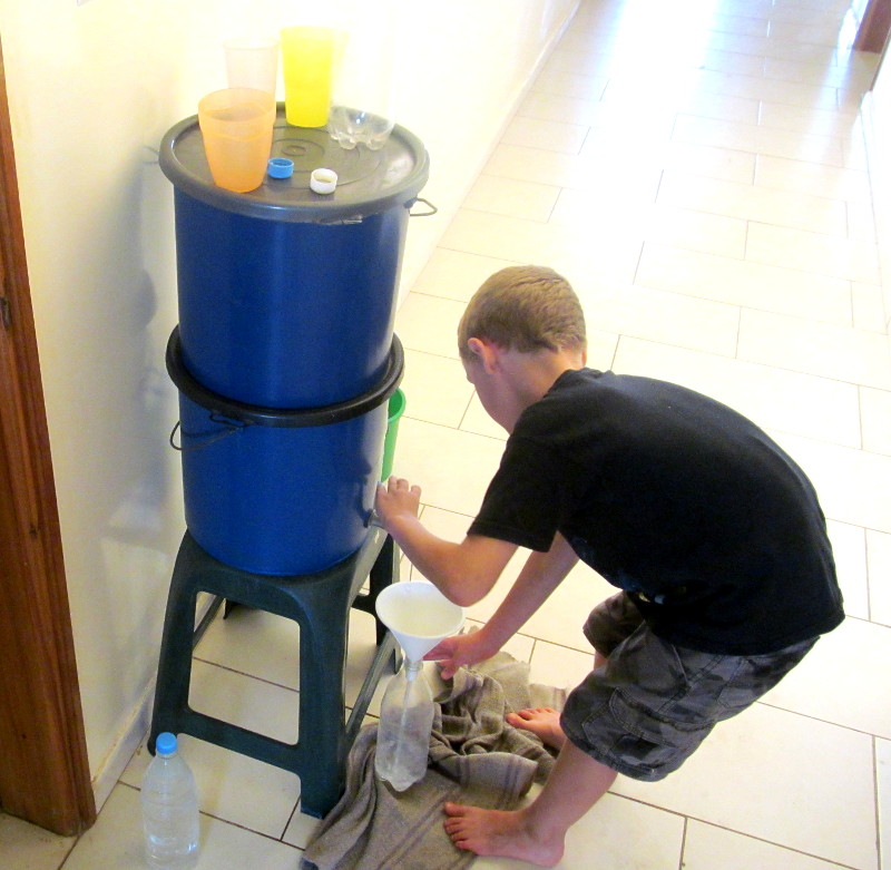 Calvin filling up water from the filter. 