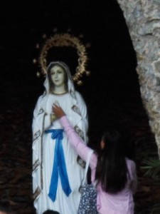 Touching the statue of Mary