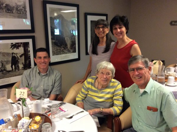 Darryl, Mae, Joy, Becky, and David have breakfast together before going to church.