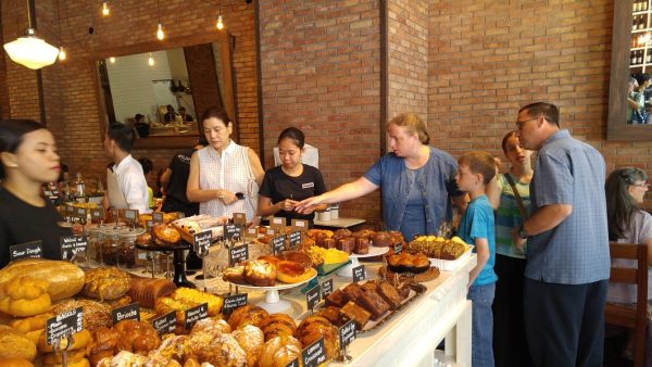 Before Sunday Church, Ginger, Rebekah, Luke, and Stephen pick out their breakfast breads in Manila.