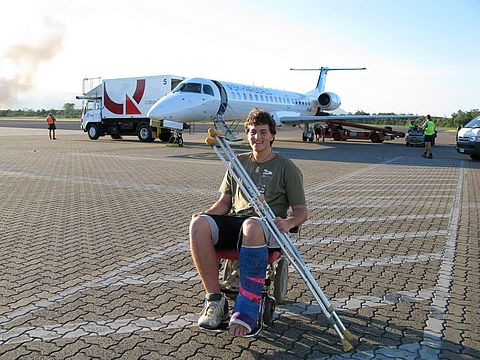 Simon arriving in Cairns, Australia for treatment of his fractured leg