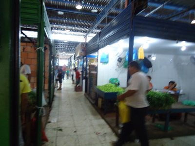 This is part of the fruit & veggie market...note the dirty floor.  This isn't even that bad. During 'high water' the floors can be flooded so much that they lay crates down for people to walk on.  Needless to say, it takes some getting used to!