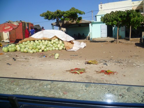 Watermelons piled on the road side