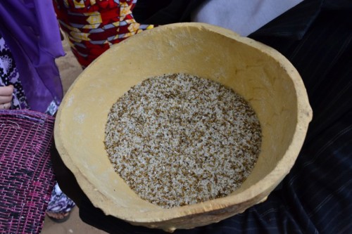 Her bowl carried rice and millet, symbols of the past a future mixed to get