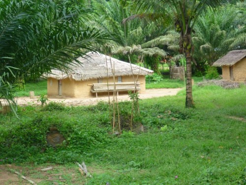 A typical village house on he left and their "kitchen" on the right