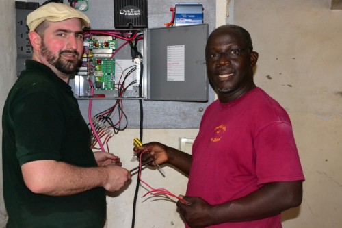 Joel and Norbert helped get their solar panels up and running.