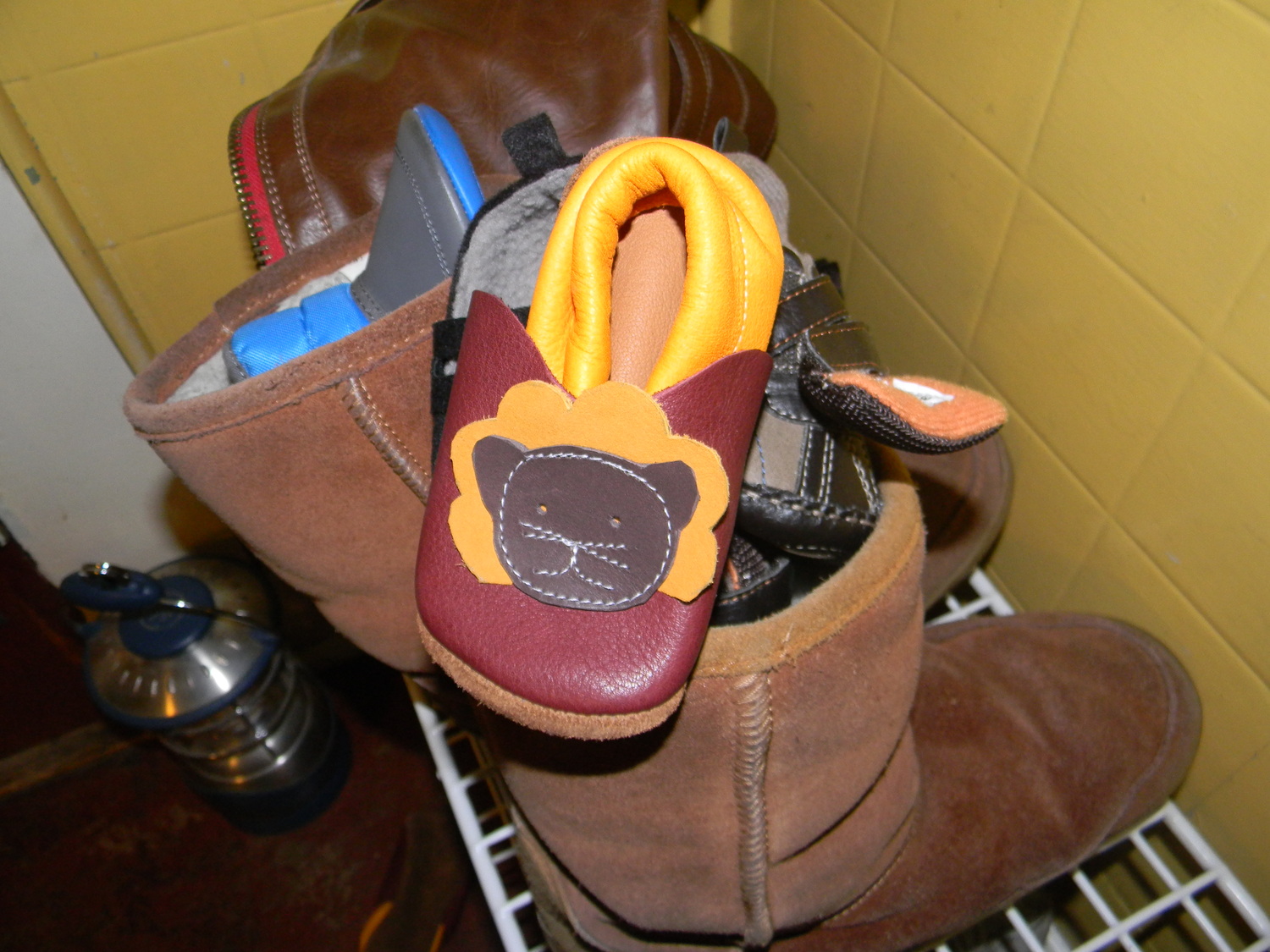 He neatly piled all of his shoes into my boots :)