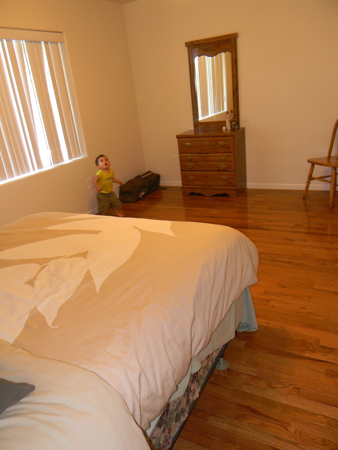Our bedroom (with Judah staring at the ceiling fan)