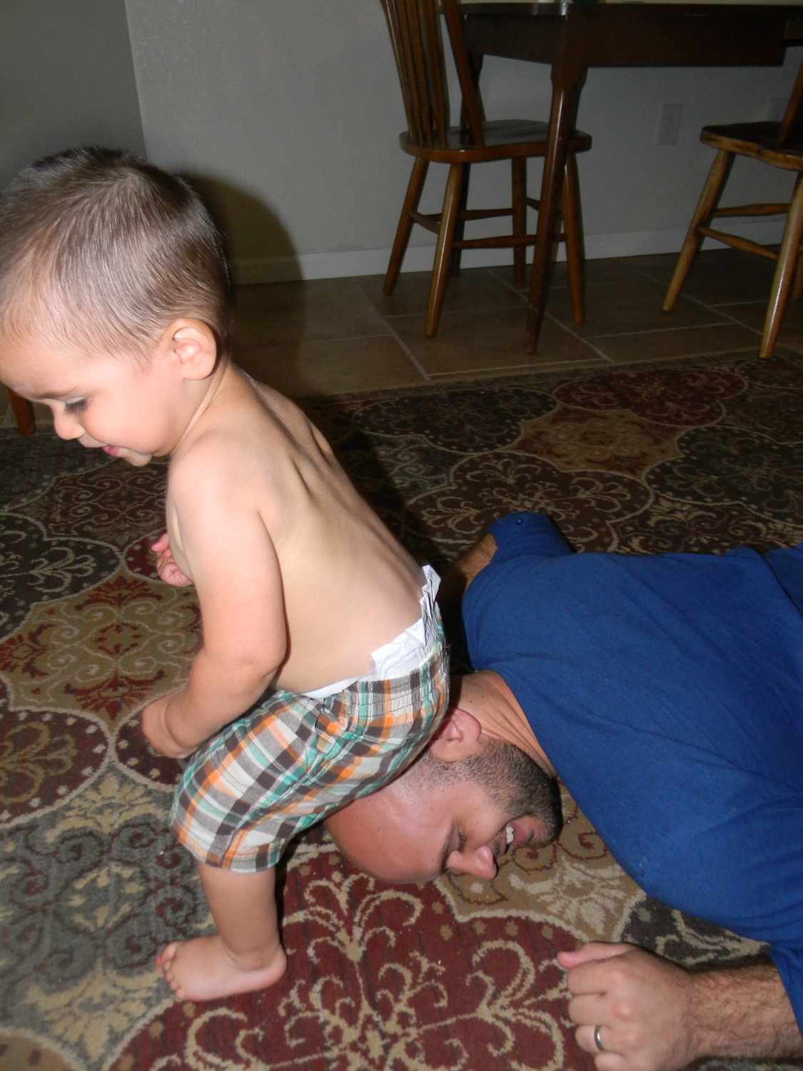 Father&son pic #2: Judah sitting on John's head, which, for some reason, he enjoys :)