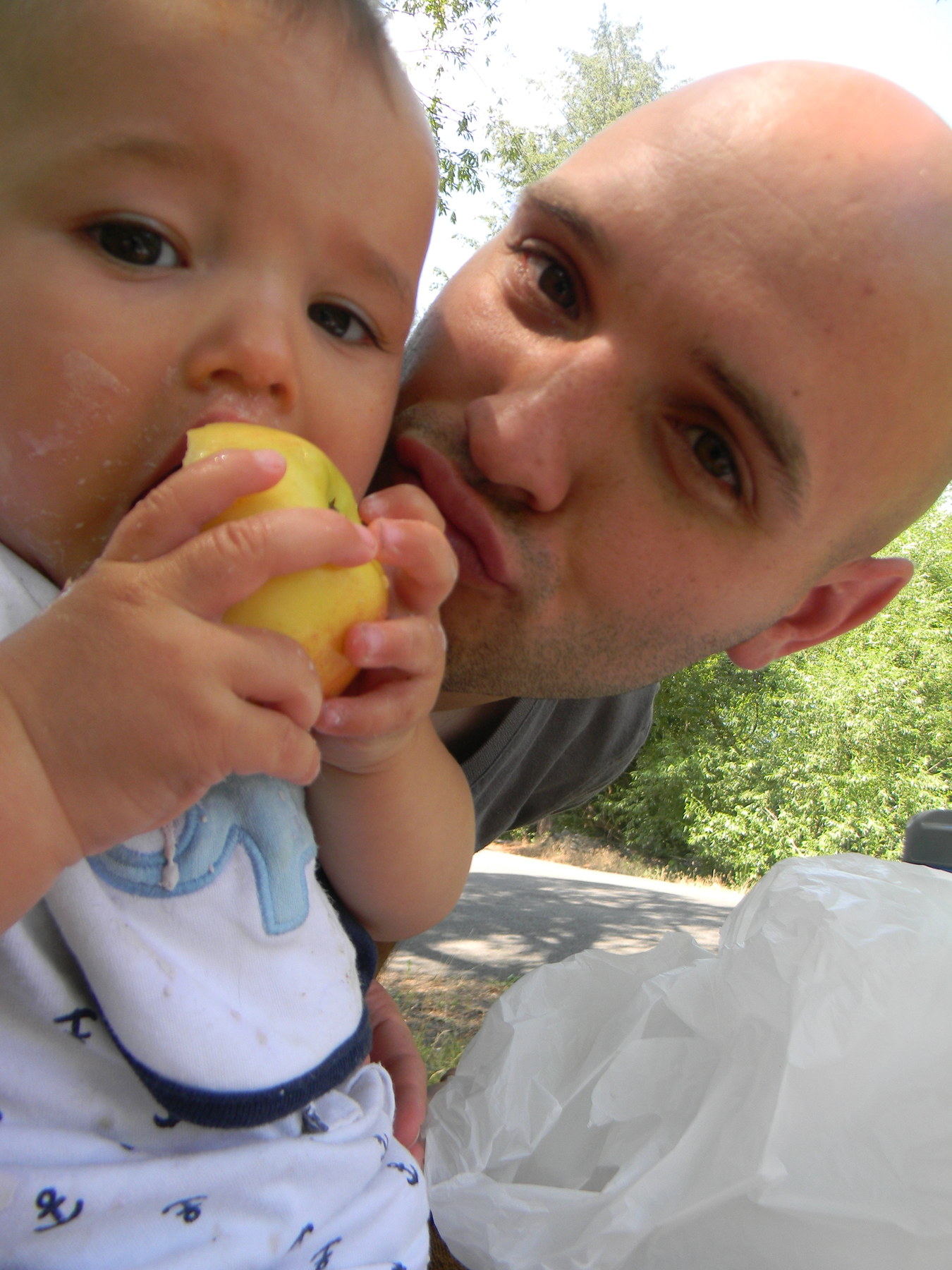 Sharing an apple with Daddy