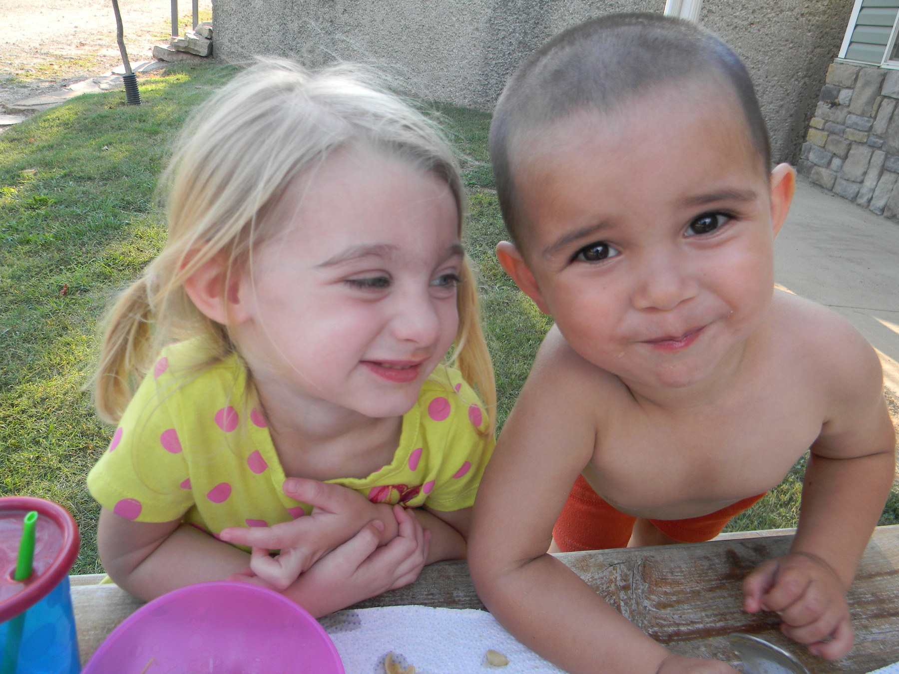 Judah and his friend Selah during the birthday dinner . Judah was so disappointed that it wasn't his birthday, but I think the donut helped a bit.