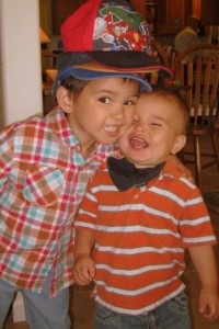 My silly boys! And Judah sporting his newest superhero hat on top of his other hats :)