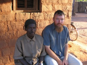 Phil sitting with a friend