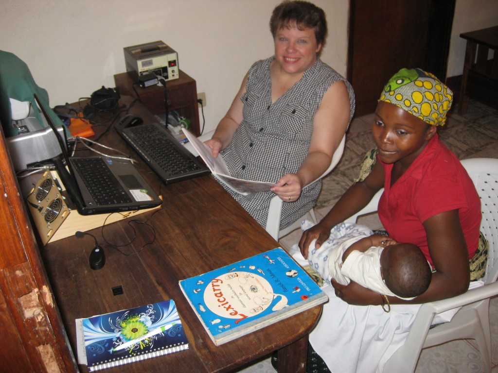 Samuel "helping" mom with the lesson...