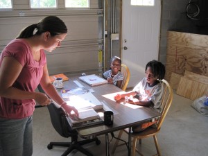 Jenny Teaching Emmanuel and Elena in the "Garage School House"