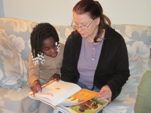 Elena and Grandma Ann looking at a book