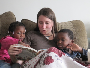 Jenny reading with the twins on the couch