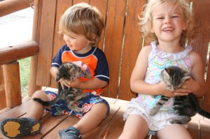 Elayne and Titus, each holding one of the kittens we encountered in Salina.