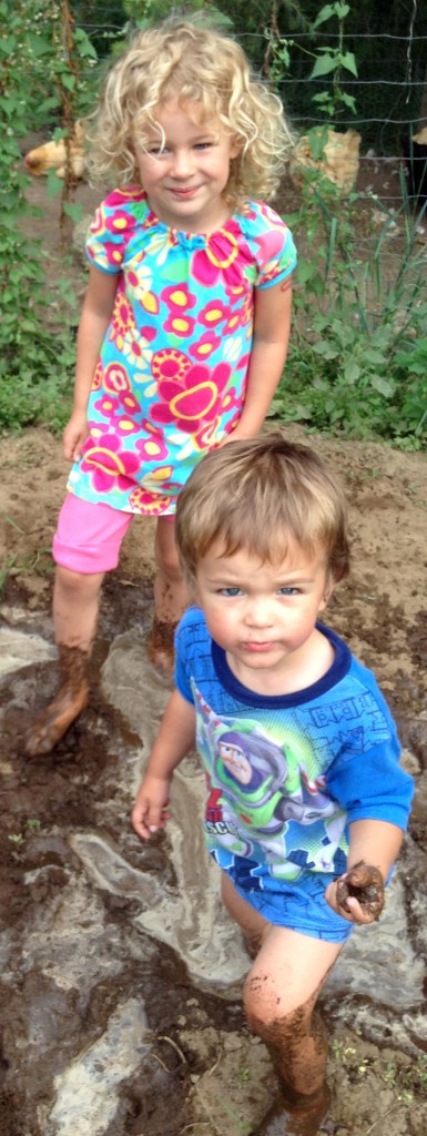 Titus and Elayne playing in the mud up in Rob and Laurie's garden.