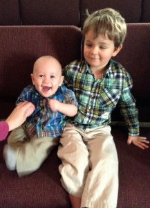 Titus sitting with his little cousin Timothy