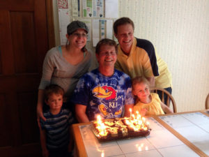 Our family with Dad Husband and a flaming cake!