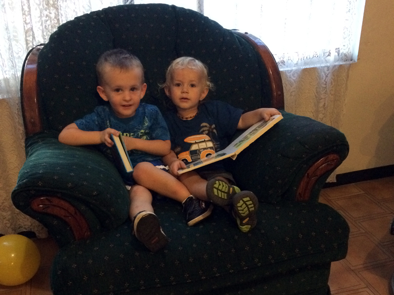 Joel loves reading books with cousin Little John whenever he comes to visit!