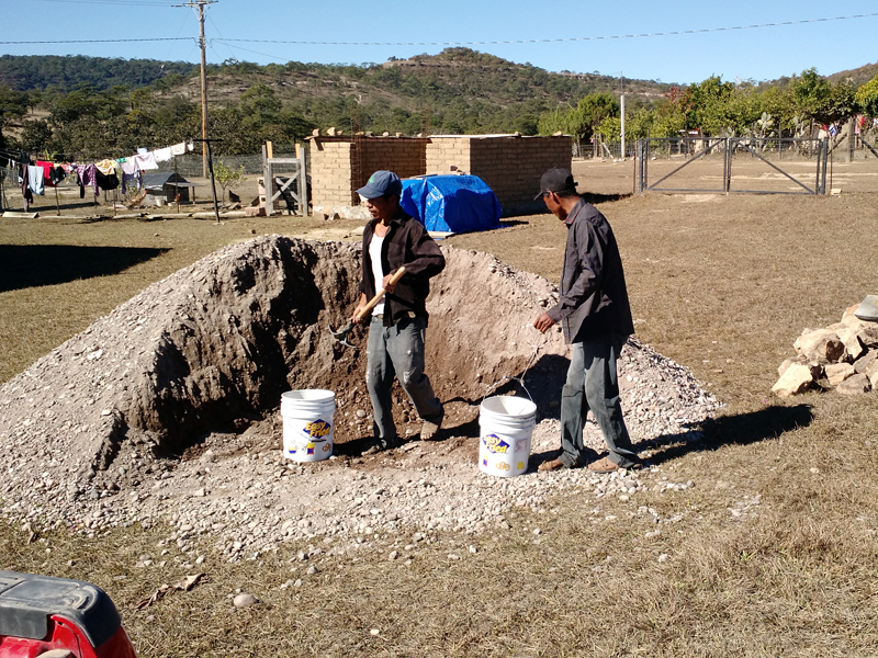 Two guys from the Nahuatl village of Las Moras, helping out with the gravel-sand mix we used to mix concrete.