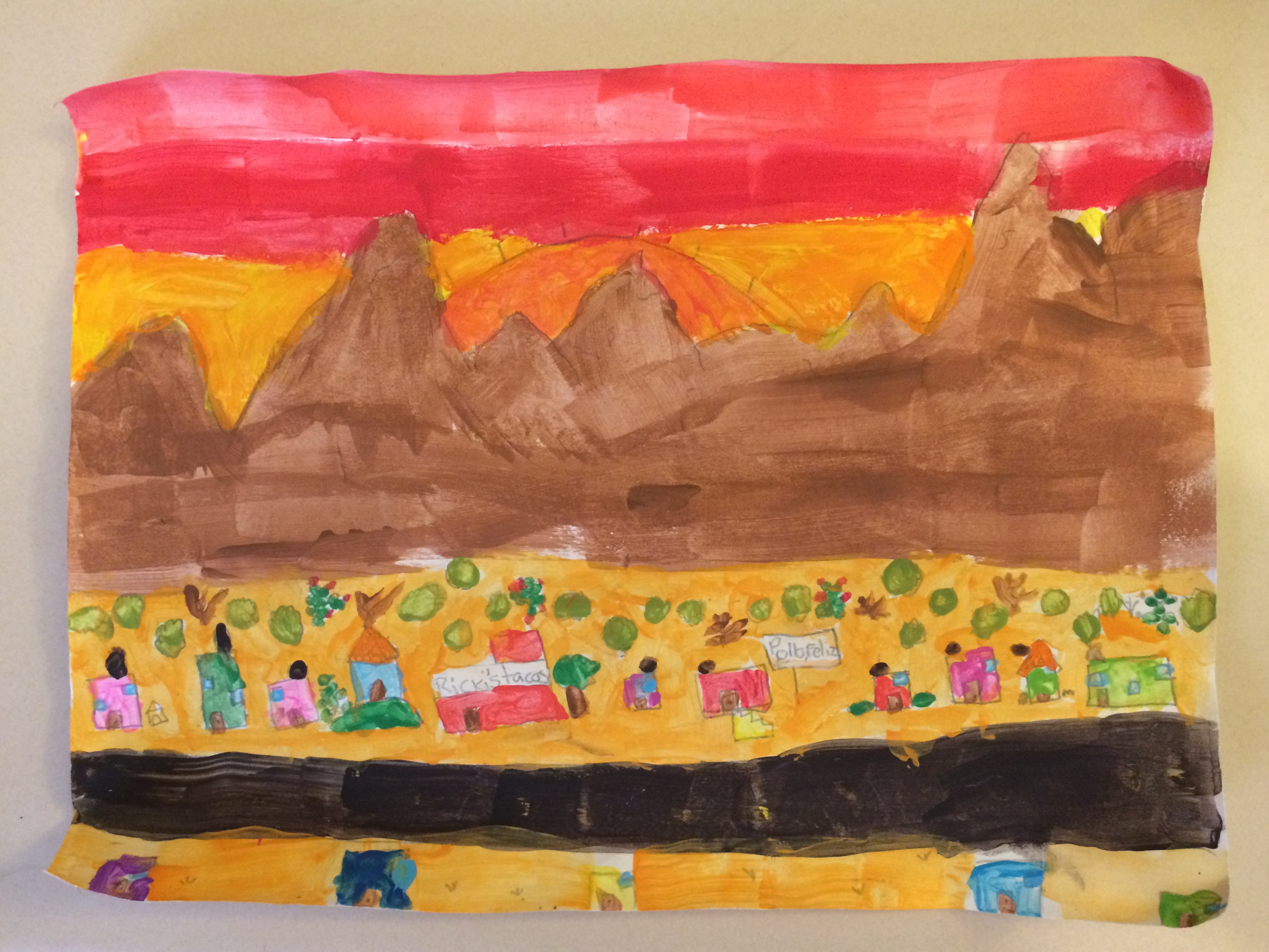 A painting done by Elayne showing sunset behind the mountains of Chihuahua, with the town and highway in the distant foreground.