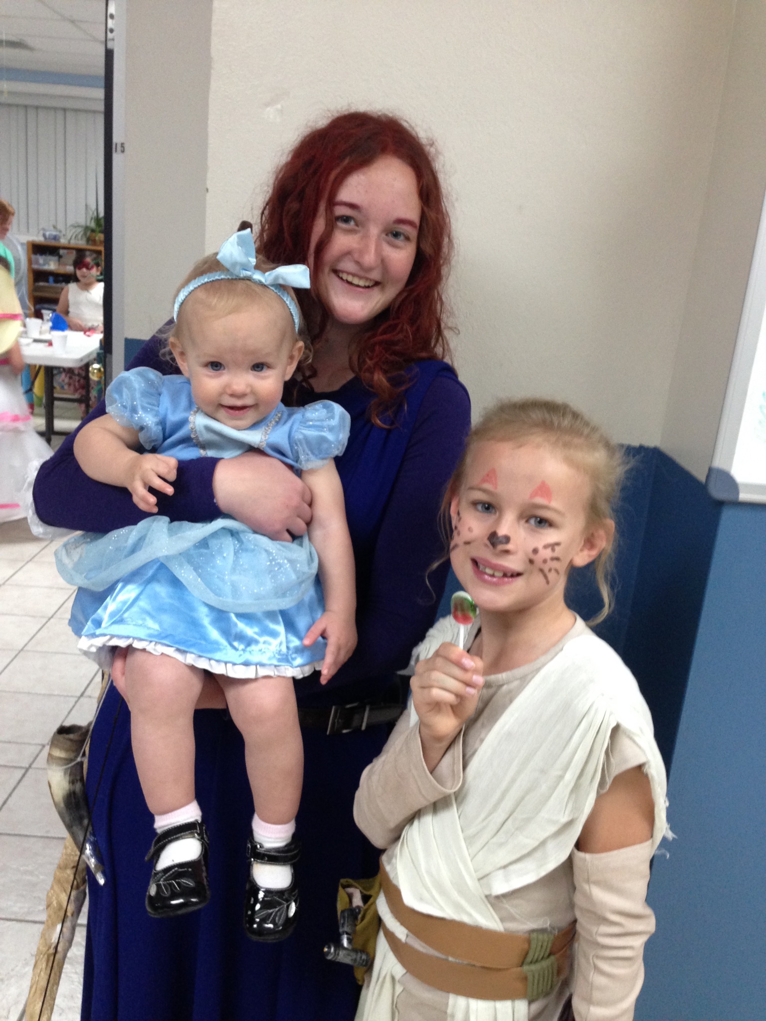 Lily dressed as Cinderella, cousin Bonnie dressed as Merida, and Elayne dressed as Rey