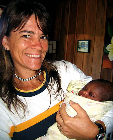 Carolyn Crockett holds the Moi baby.