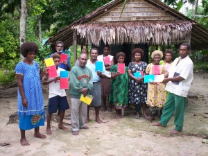 The Tigak believers with their new Scripture portions.