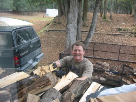 Peter gets the firewood in for the long winter.