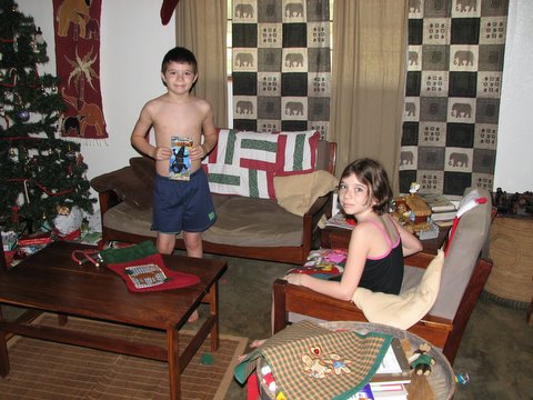 THE KIDS OPENING THEIR STOCKINGS ON CHRISTMAS MORNING
