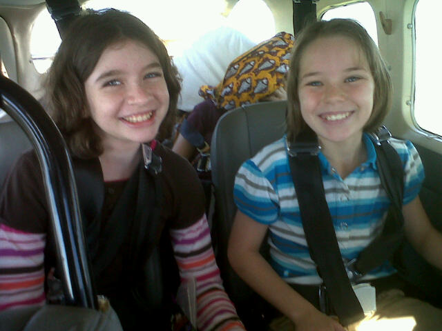 GIRLS SHARING SOME IN-FLIGHT SMILES