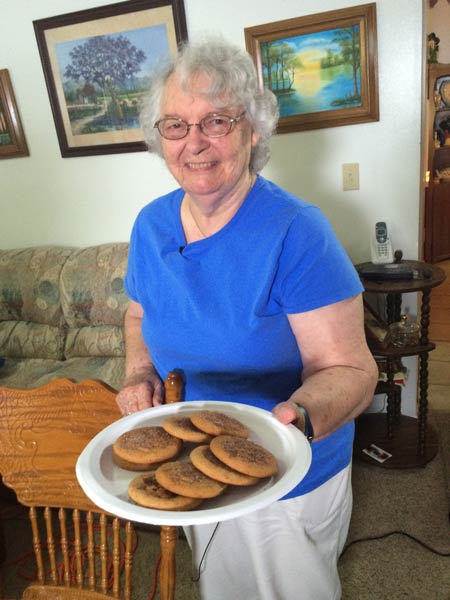 Elsie Gill offers us cookies as we interview her and her husband Len.