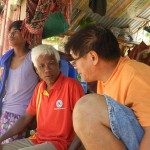 NTMPI relief coordinator, Rene T. (right) discussing relief efforts with Tagbanwa leader. 