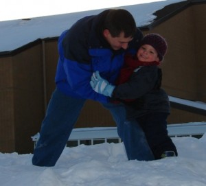 Uncle Paul playing with Jonathan in the snow