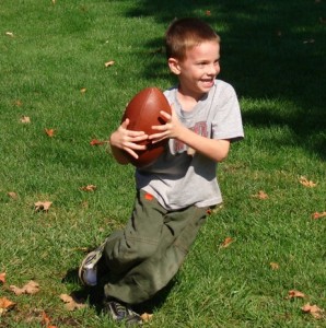 Luke loved playing football here in the States . . . with no breathing problems!