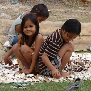 Agutaynen kids drying coconut meat.