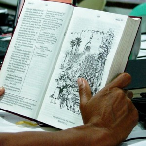 Agutaynen holding the Agutaynen New Testament