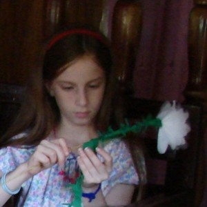 Abigail making a flower