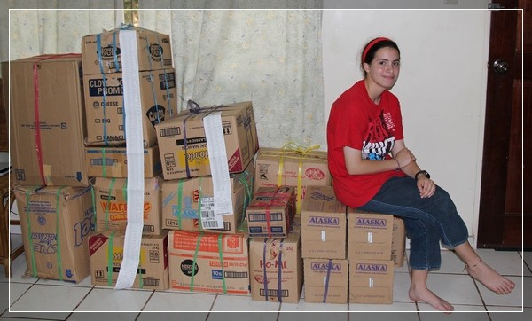 Rebekah with 19 boxes of supplies.