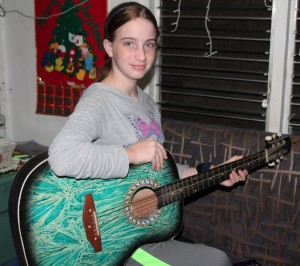 Abigail practicing the guitar