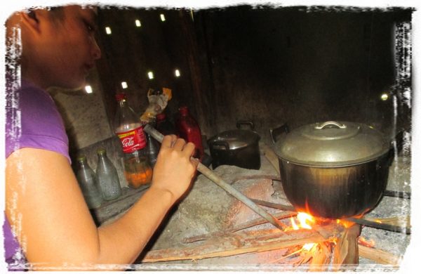 Villager starts a fire for dinner