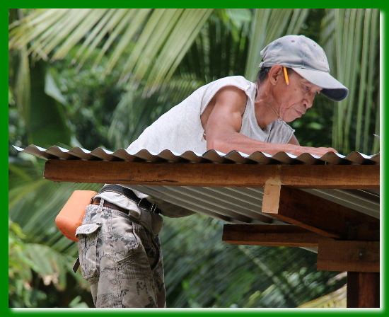 Worker Replacing the Roof on the Playhouse