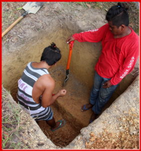  Emel and Jonathan digging one of 22 holes.